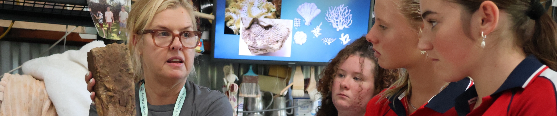A group of high school students learn about conservation.