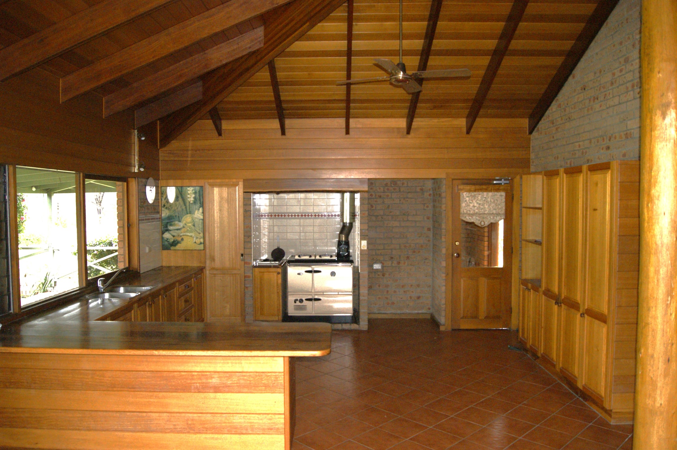 The kitchen with a wooden finish