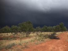A storm approaching a dry grassland