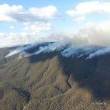 Smoke from a bushfire drifts across ranges